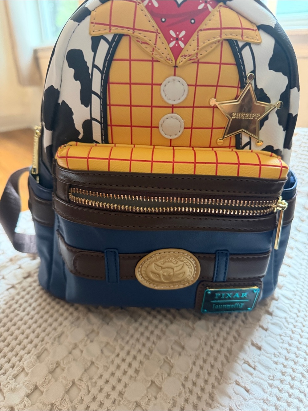 Loungefly Pixar Toy Story Woody Mini Backpack in Yellow, Brown, Blue, Black